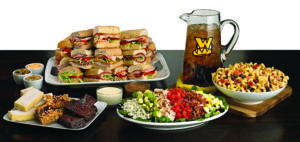 Which wich catering spread featuring sandwich variety, cobb salad, pasta, and brownies